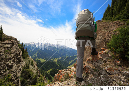 young woman hiker hiking on mountain top young woman hiker hiking on mountain top 31576926