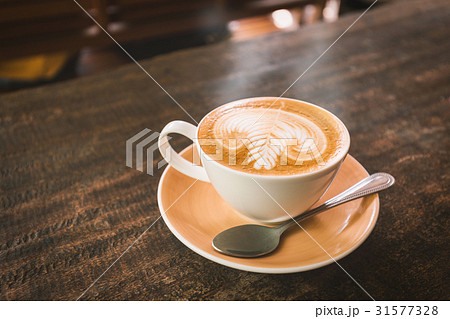 Hot coffee on wood table Hot coffee on wood table 31577328