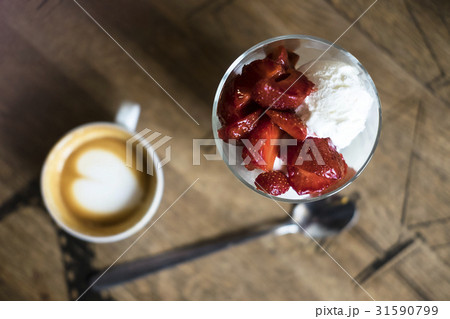Ice cream with strawberries and coffee 31590799