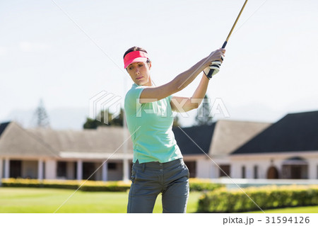 Golfer woman taking shot 31594126
