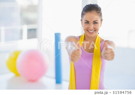 Portrait of happy woman at fitness studio 31594756