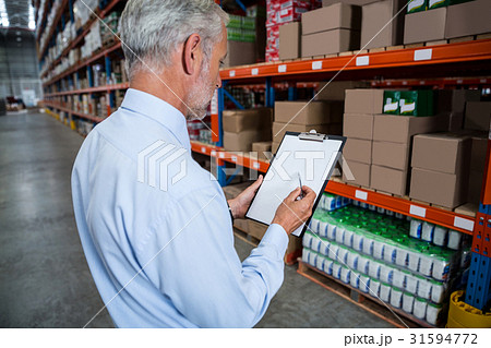 Worker holding clibpoard Worker holding clibpoard 31594772