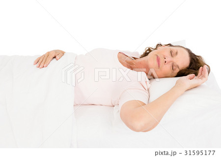 Mature woman relaxing on bed Mature woman relaxing on bed 31595177