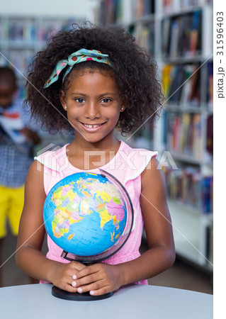 Smiling girl with globe Smiling girl with globe 31596403