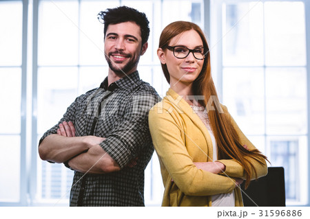 Smart business people standing with arms crossed Smart business people standing with arms crossed 31596886