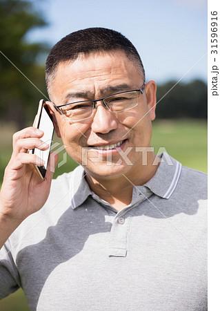 Portrait of golfer smiling and calling Portrait of golfer smiling and calling 31596916