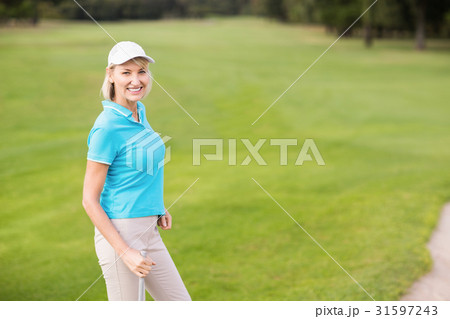 Portrait of cheerful golfer 31597243
