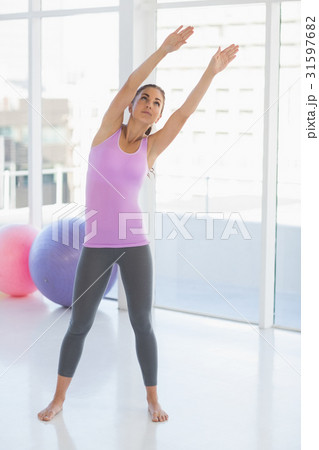 Full length of woman exercising 31597682
