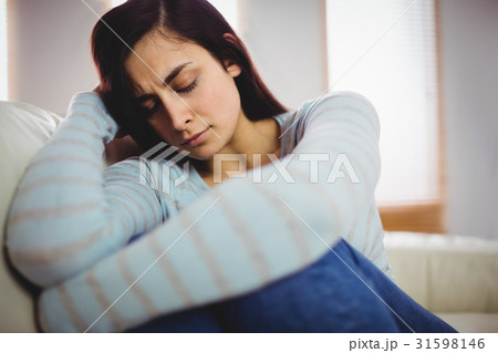 Sad yooung woman at home 31598146