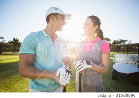 Cheerful golf player couple 31598996