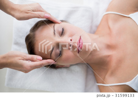 Masseur massaging woman Masseur massaging woman 31599133