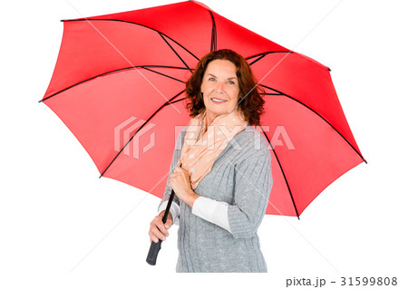 Portrait of happy mature woman holding umbrella 31599808