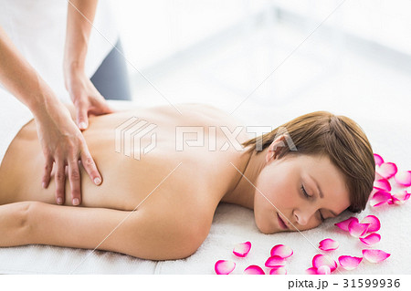 Relaxed Woman Being Back Massaged By Masseuseの写真素材