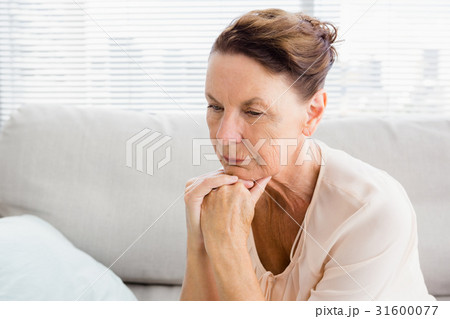 Close-up of thoughtful woman with hands on chin Close-up of thoughtful woman with hands on chin 31600077