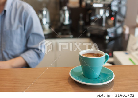 Cup of an americano in a blue cup Cup of an americano in a blue cup 31601702