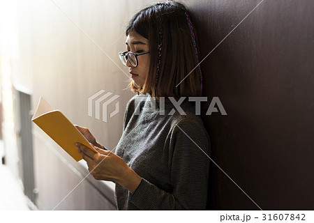 Girl with Glasses Standing Reading Book Girl with Glasses Standing Reading Book 31607842