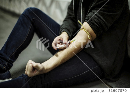 Junkie People Using Syringe Injecting Narcotic Illegal Drugs 31607870