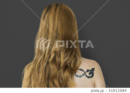 Young Adult Woman Back with Tattoo Studio Portrait 31612084
