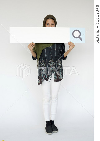 Woman standing and holding banner Woman standing and holding banner 31612348