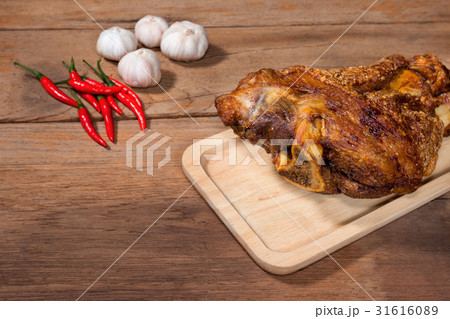 fried pork leg cooked on wood background 31616089