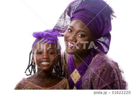 African lady in traditional dress with small girl 31622220
