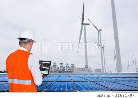 Engineers working at wind turbine power station Engineers working at wind turbine power station 31631797