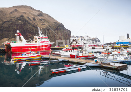 Fishing boats in port of Vestmannaeyjar Fishing boats in port of Vestmannaeyjar 31633701