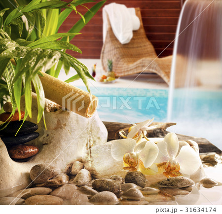 Spa concept with stones orchids waterfall in pool  31634174