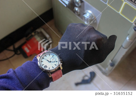 Hand and tools stealing a safety deposit box. Hand and tools stealing a safety deposit box. 31635152