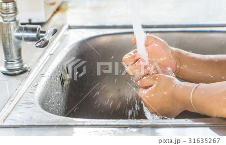 Asian girl is watching her hand with clean water Asian girl is watching her hand with clean water 31635267