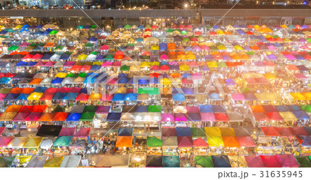 Aerial view multiple colour night market roof 31635945