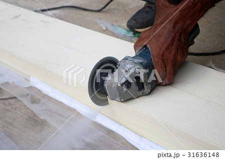 Electric circular saw cutting the artificial wood. 31636148