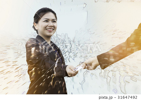 Businesswoman exchanging credit card with crowd 31647492