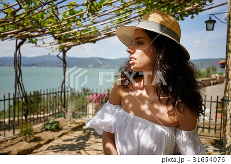 Beautiful woman on the terrace of an Italian country garden 31654076