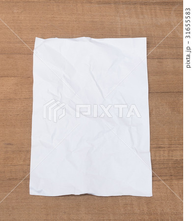 White paper sheet, paper crumpled on a wooden White paper sheet, paper crumpled on a wooden 31655583