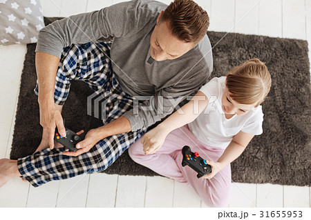 Dedicated cute gamers focused on the game 31655953