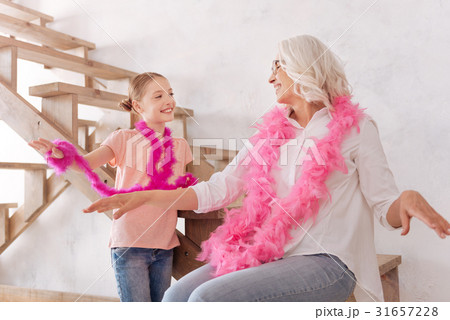 Delighted positive grandmother and granddaughter 31657228