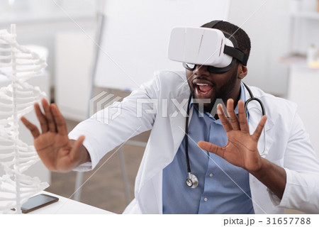 Nice professional doctor using the newest 31657788