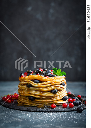 Pancakes with fresh berries and maple syrup Pancakes with fresh berries and maple syrup 31660483