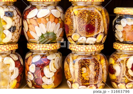Homemade honey with dried fruits and nuts on the 31663796