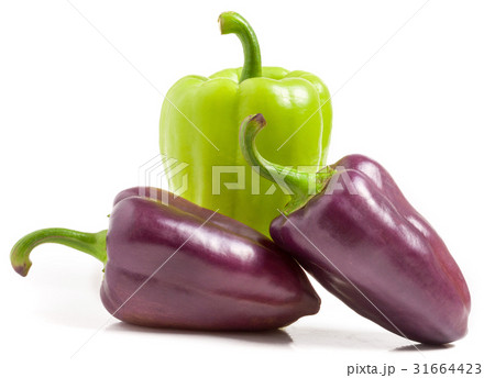 Green and purple bell peppers isolated on white 31664423