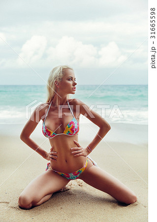 Premium Photo | Beautiful woman in bikini posing on the beach in thailand