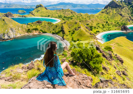 Young woman enjoying the awesome view of Padar Young woman enjoying the awesome view of Padar 31665695