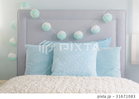 blue pillows with decorative ball on headboard blue pillows with decorative ball on headboard 31671083
