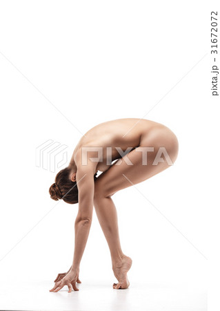 Nude female making meditation pose Nude female making meditation pose 31672072