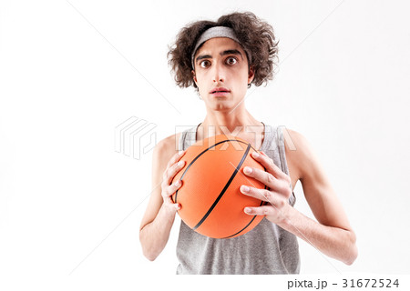 Scared slim guy playing basketball Scared slim guy playing basketball 31672524