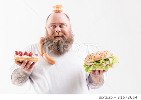 Joyful fat man prefers unhealthy eating 31672654