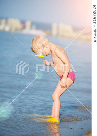 Cute little kid wearing mask and flippers for Cute little kid wearing mask and flippers for 31673624