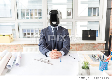 Concentrated android is laboring against window Concentrated android is laboring against window 31674149