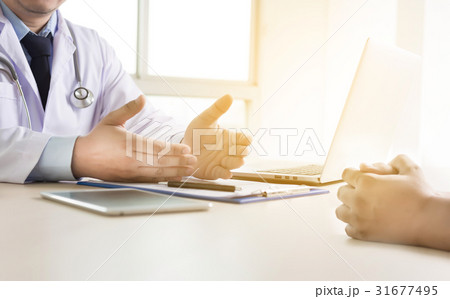 doctor taking patient are discussing in on c doctor taking patient are discussing in on c 31677495